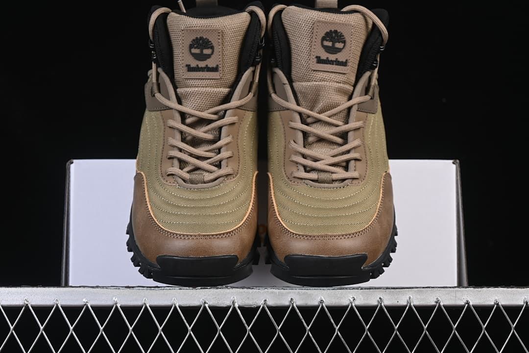 Front view of the pair showing laces, tongue patches, and rugged black outsoles.