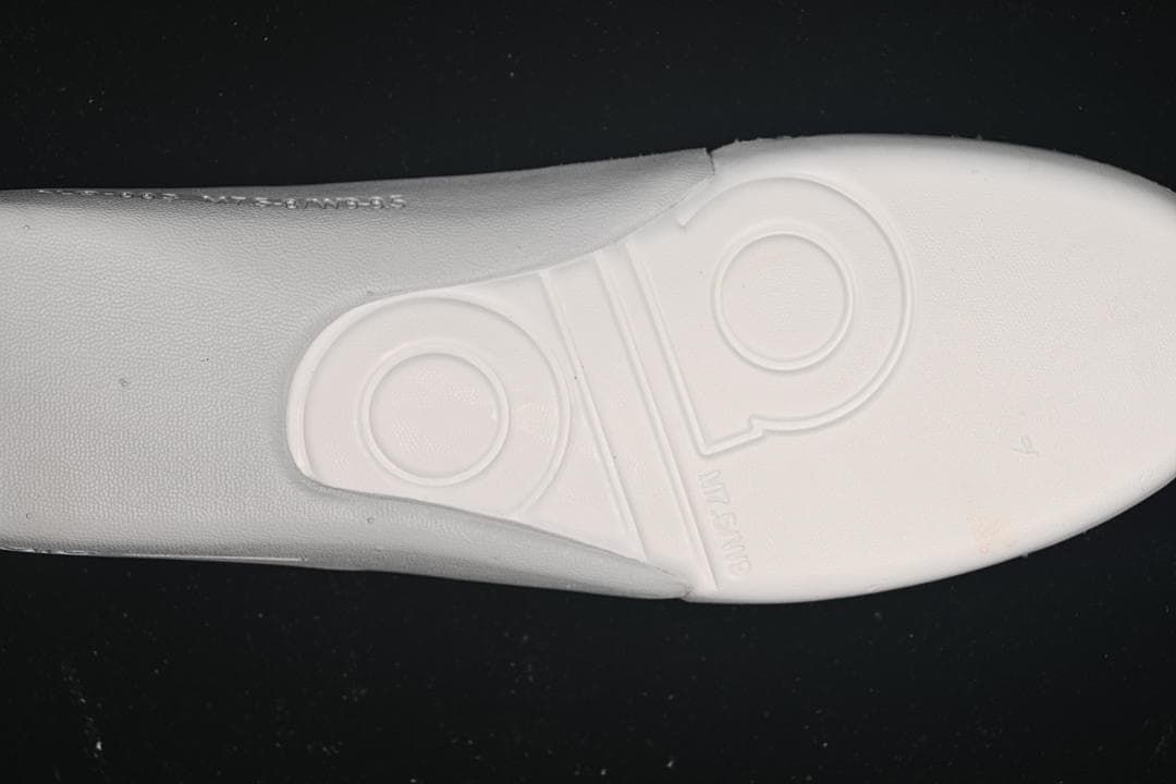 Close-up of the sneaker outsole with embossed branding