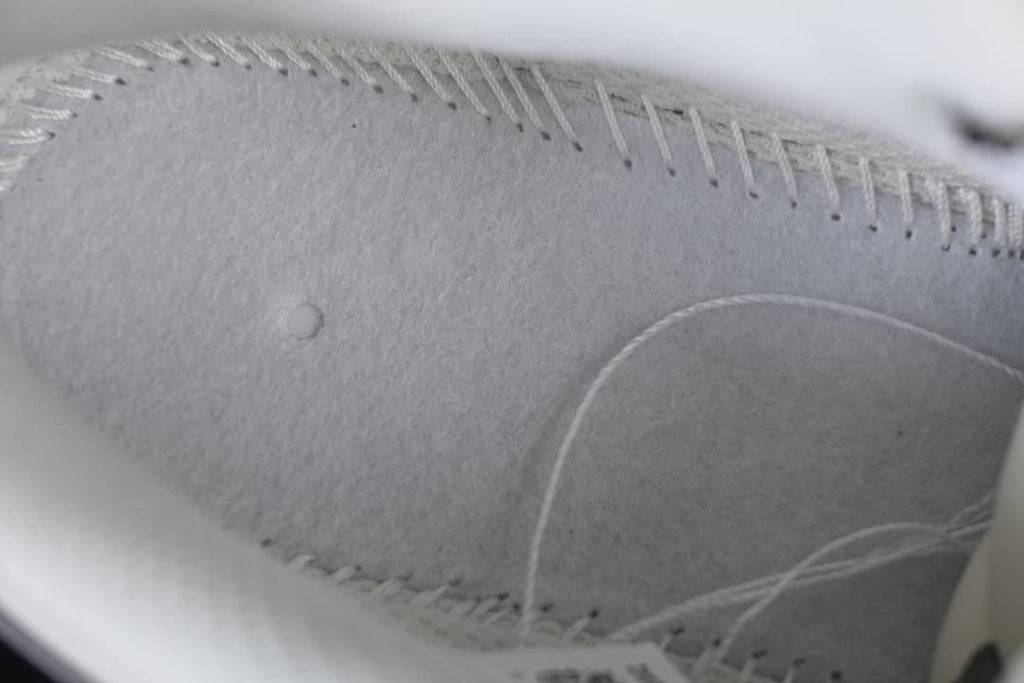 Close-up detail of stitching and panel construction on the shoe