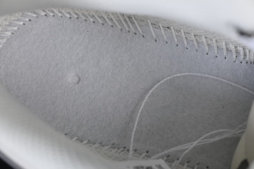 Close-up detail of stitching and panel construction on the shoe