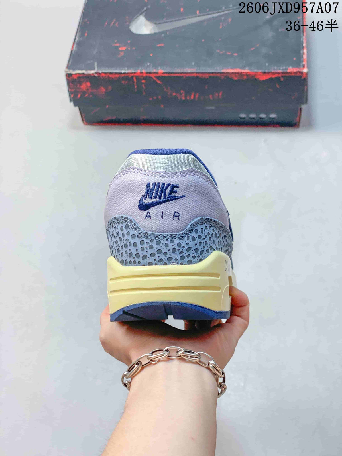 Rear view of the Nike Air Max 1 '86 Premium sneaker with blue and cream heel details.