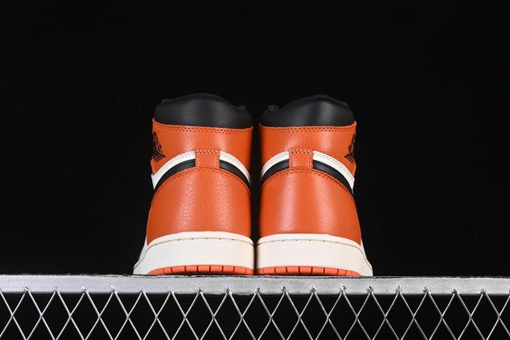 Rear view of the pair showing orange heel panels