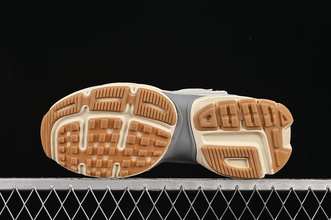 Underside view showing the patterned gum-colored outsole