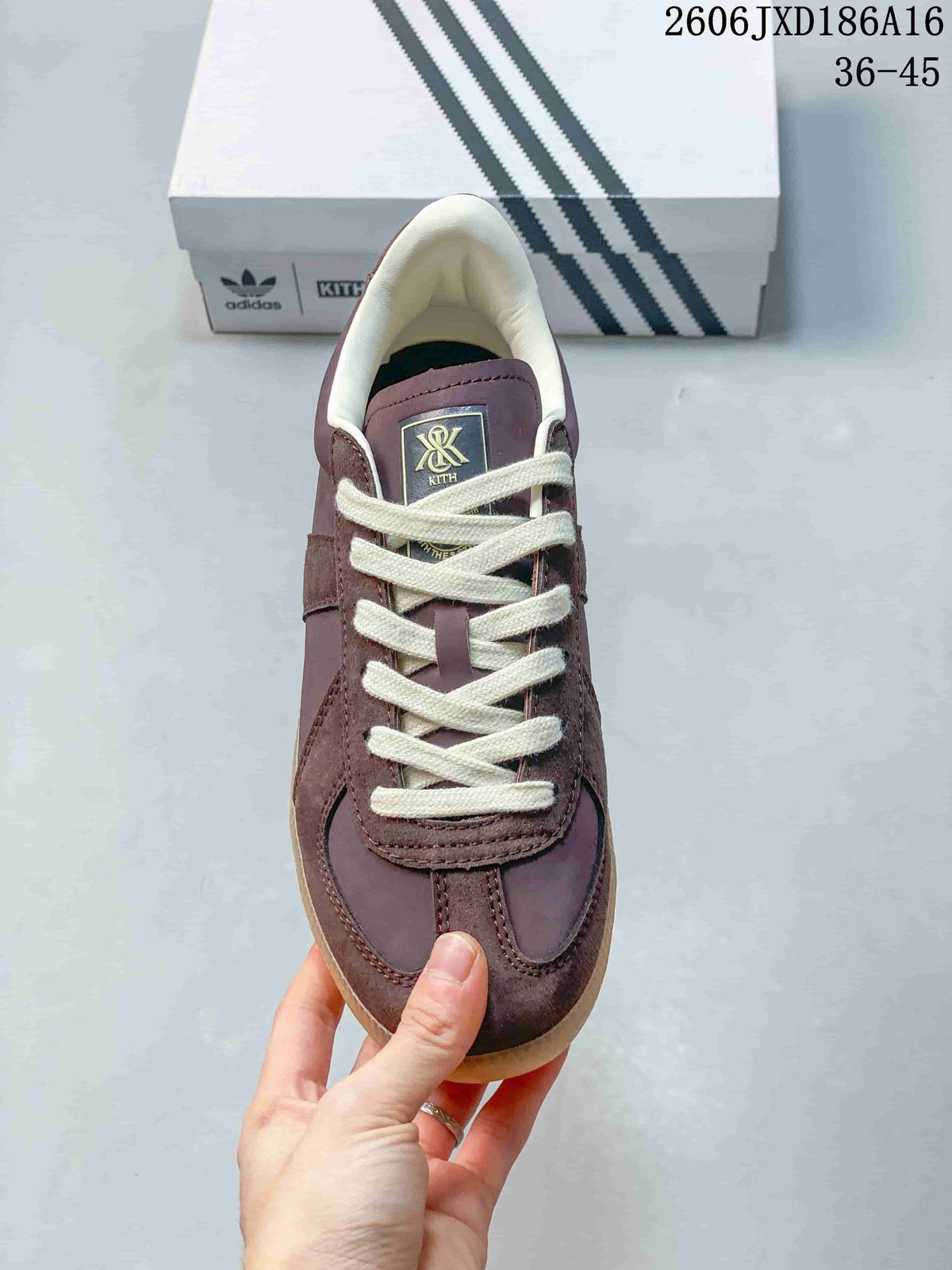 Top view of the sneaker with cream laces and Kith tongue label