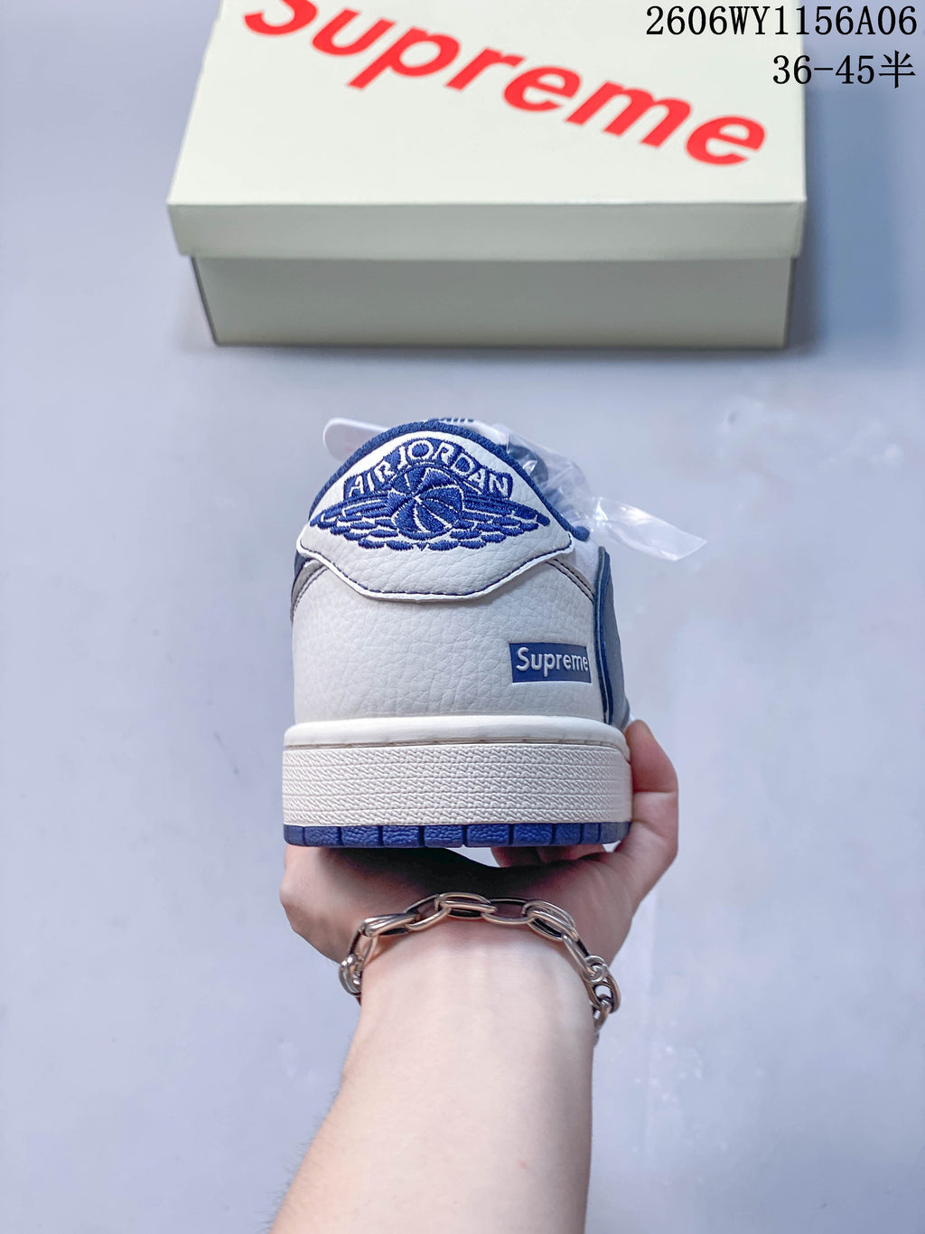Rear view showing embroidered heel detail and a small heel label