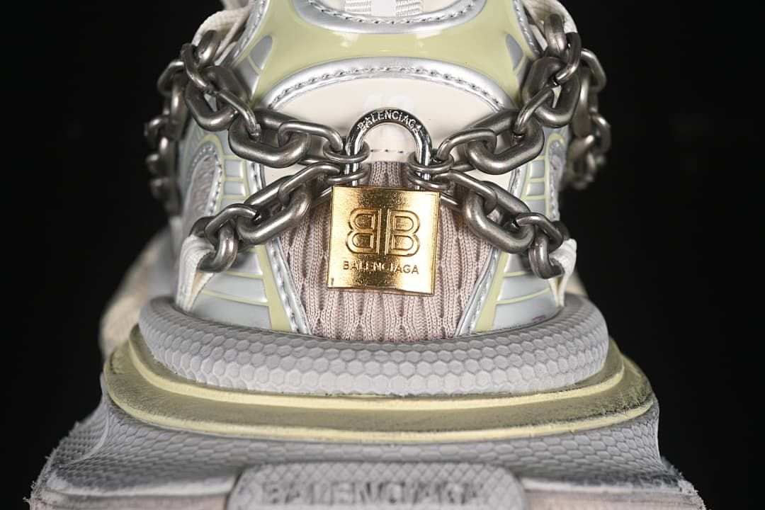 Rear view highlighting the chain detail and gold-tone plaque.
