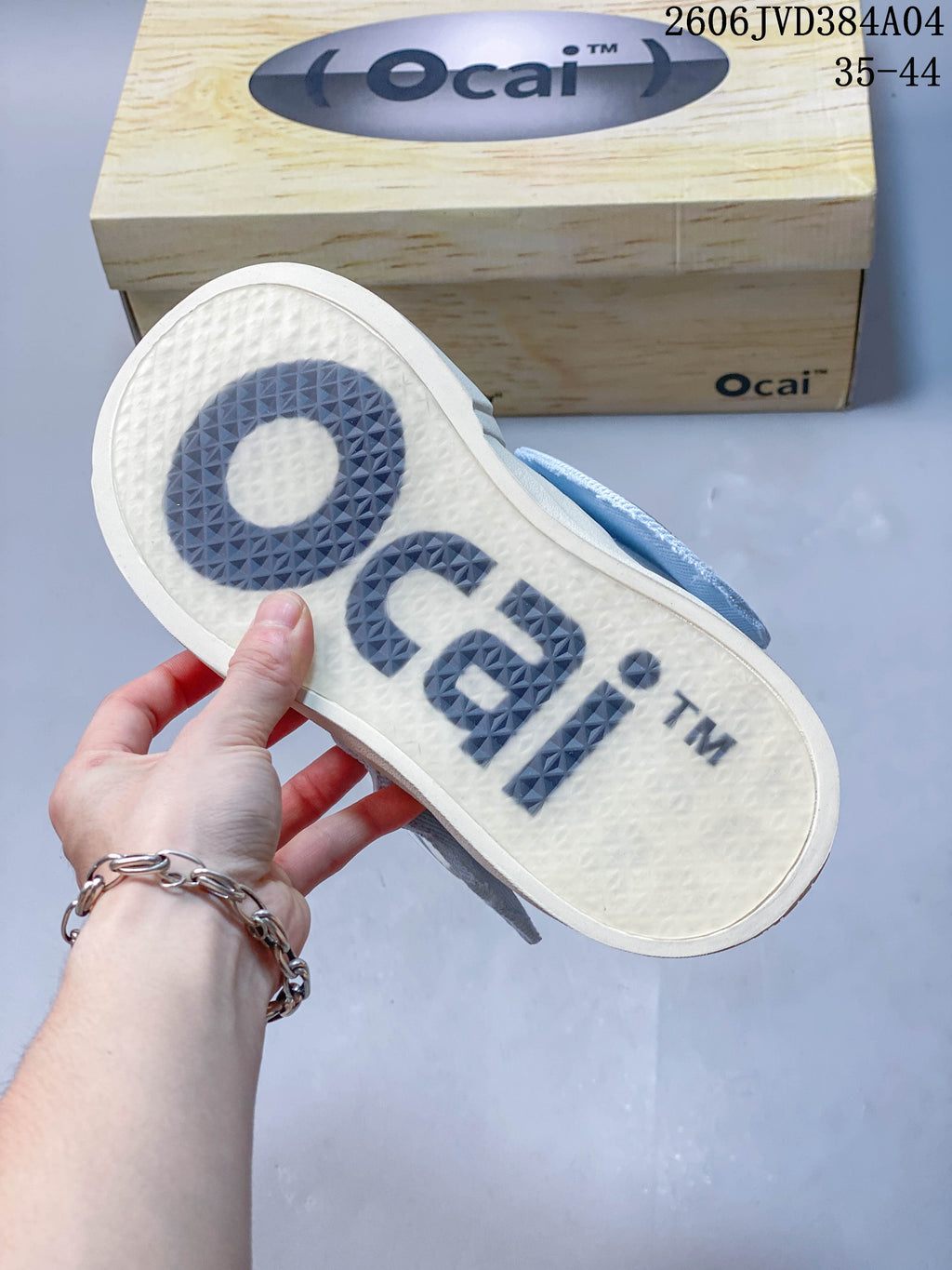 Close-up of the textured outsole with large Ocai branding