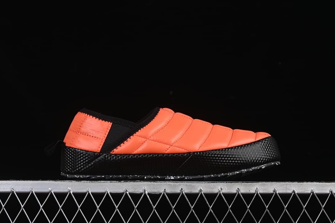 Side profile of the orange and black mule