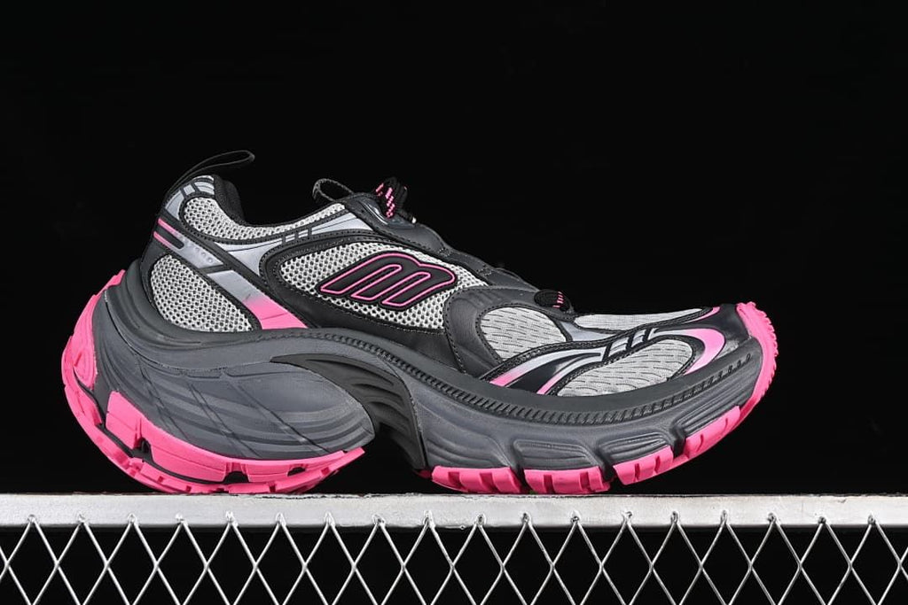 Side profile of the sneaker with layered grey, black and pink detailing