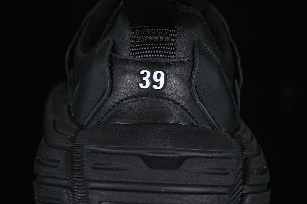Rear view of the shoe showing a size 39 marking and heel pull loop