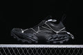 Black Hike Trail sneaker in side profile with cord lacing and a chunky lugged sole.