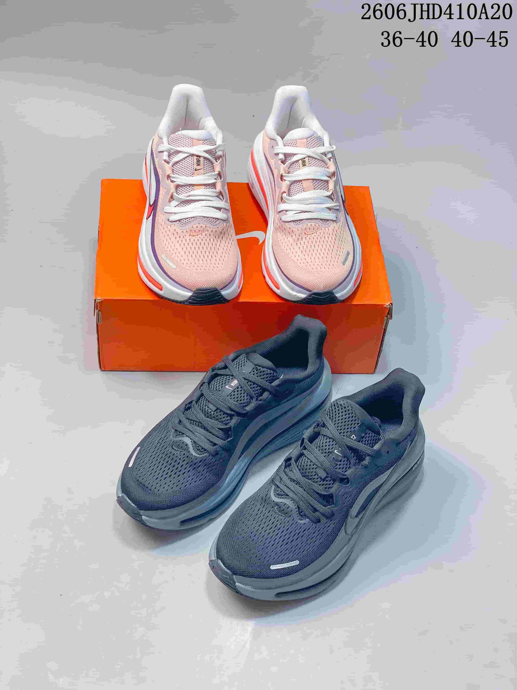 Pale pink and dark gray Nike Air Zoom Winflo 12 shoes shown together.