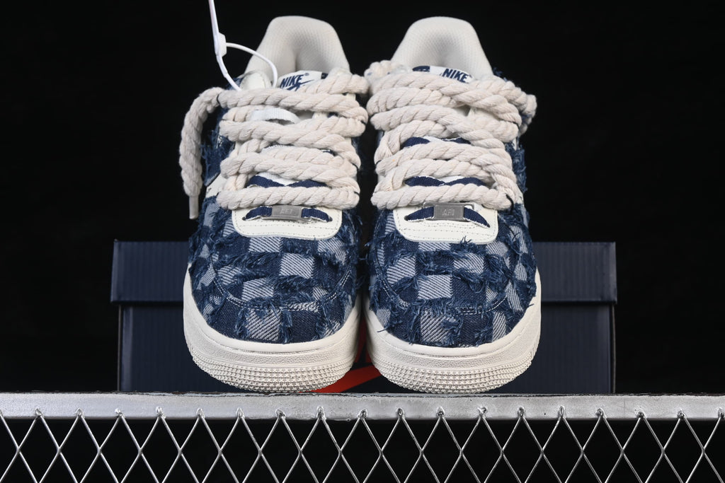 Front view of the pair showing patterned toe panels and oversized laces
