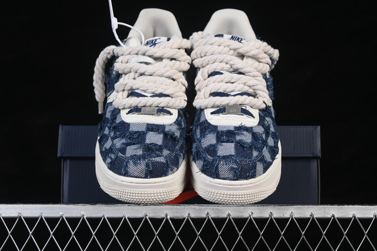 Front view of the pair showing patterned toe panels and oversized laces