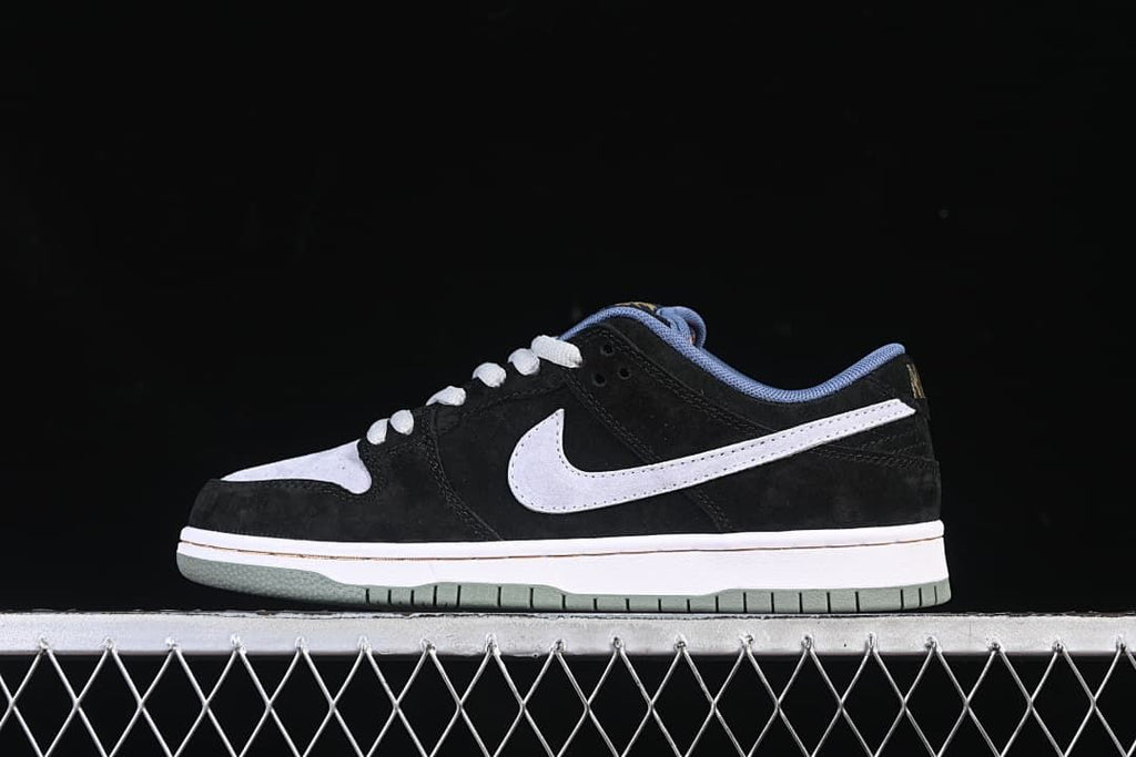 Side profile of the black and grey Nike SB Dunk Low sneaker