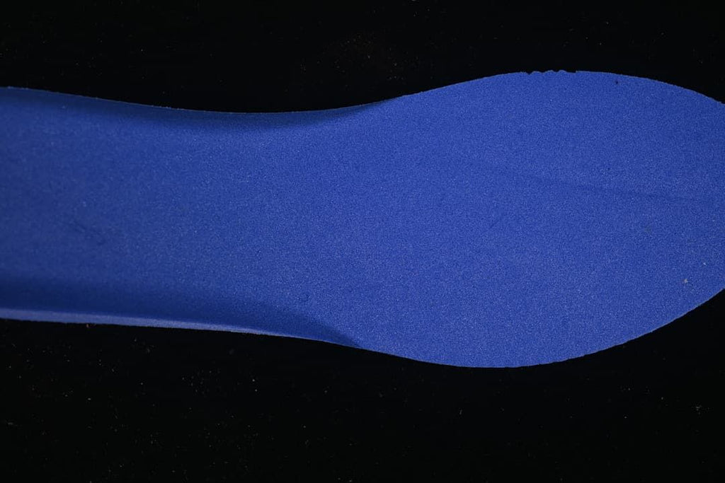 Blue shoe-shaped insert shown against a dark background