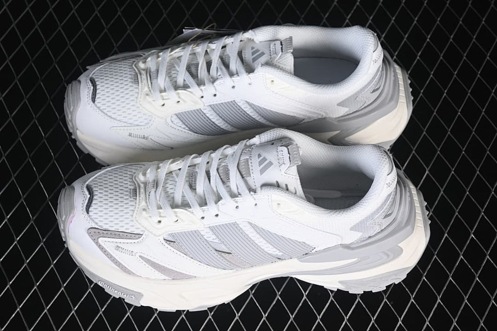 Pair of white and grey adidas XLG Storm Edge sneakers viewed from above