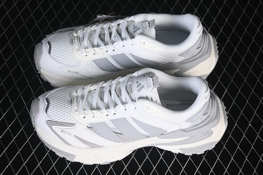 Pair of white and grey adidas XLG Storm Edge sneakers viewed from above