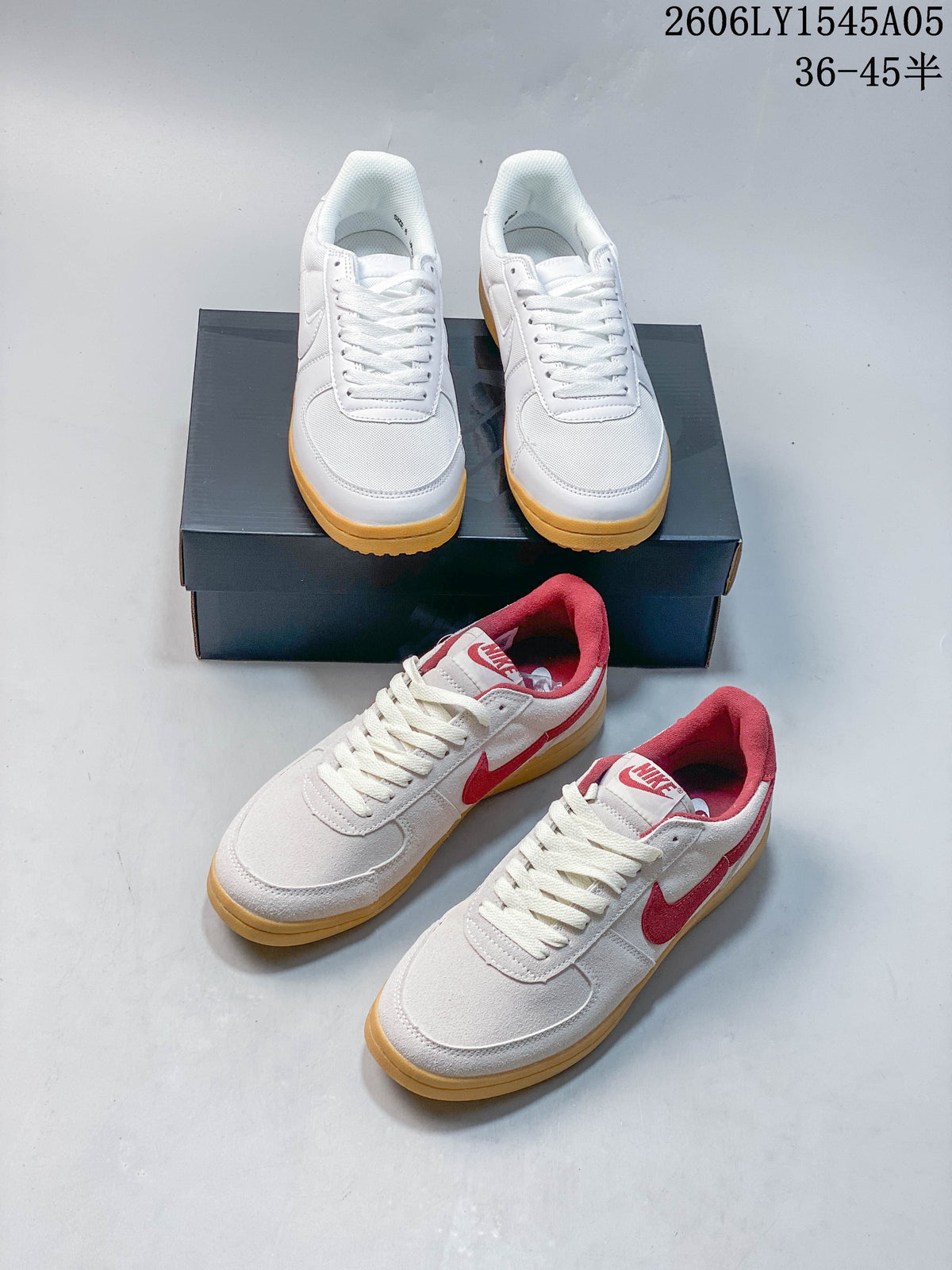 White and red-accented low-top sneakers displayed together; white pair has gum-colored soles.