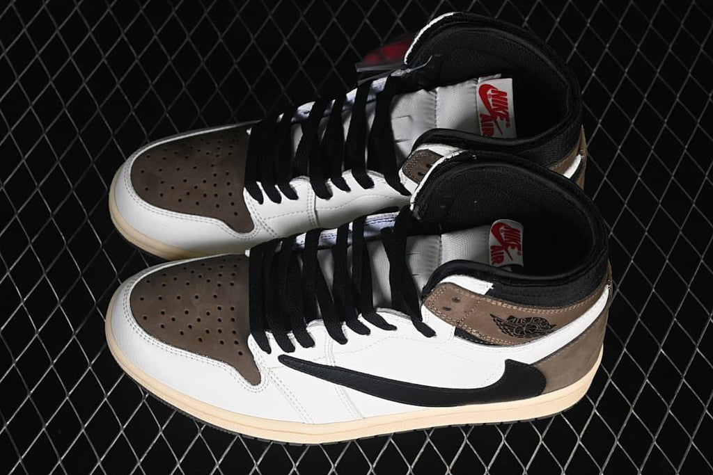 Pair of brown, white, and black high-top sneakers viewed from above