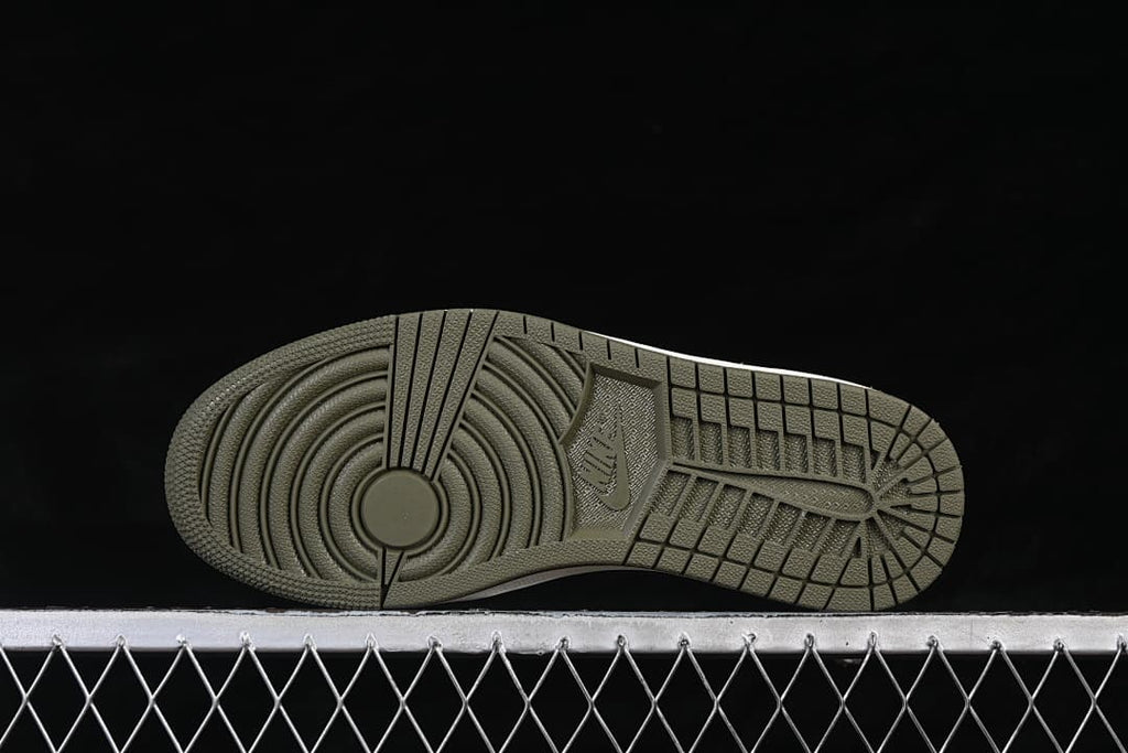 Underside view of the olive outsole and circular tread pattern