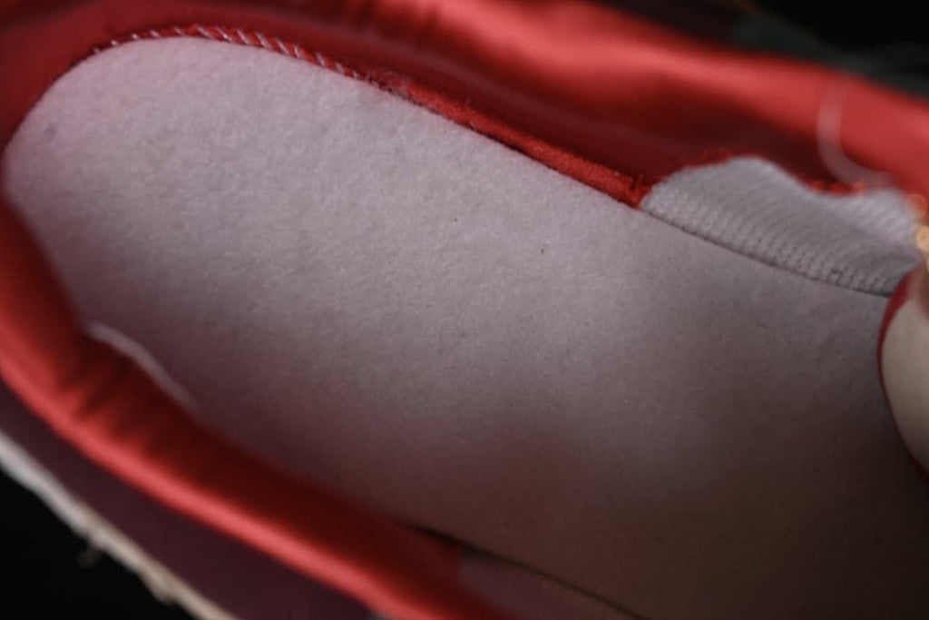Close-up of the sneaker’s red-lined interior.
