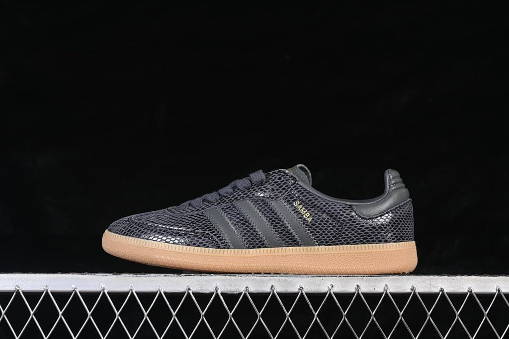 Side profile of a single dark grey Samba OG sneaker
