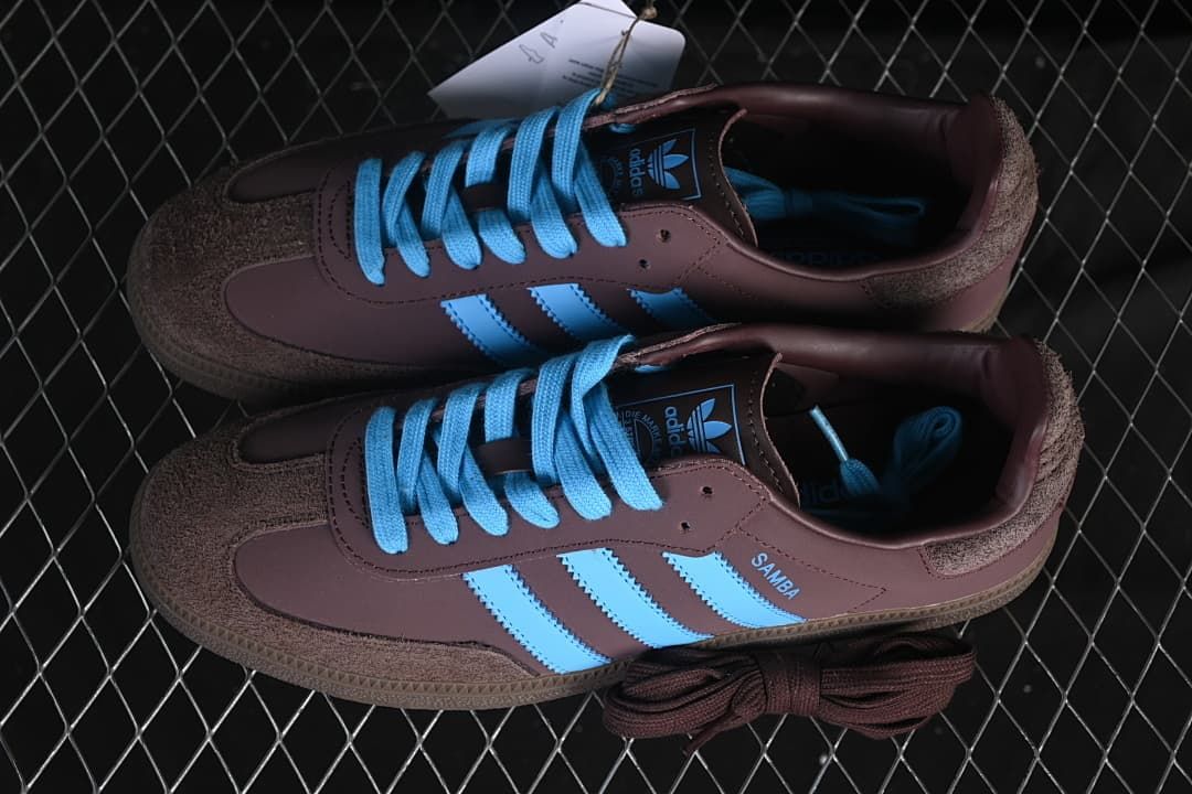 Pair of brown and blue Samba OG sneakers with an additional brown lace set.