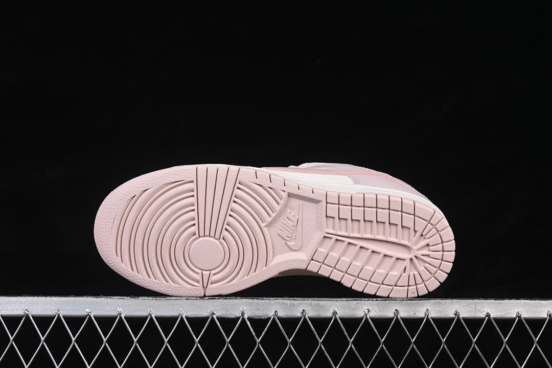 Underside view showing the pink rubber tread