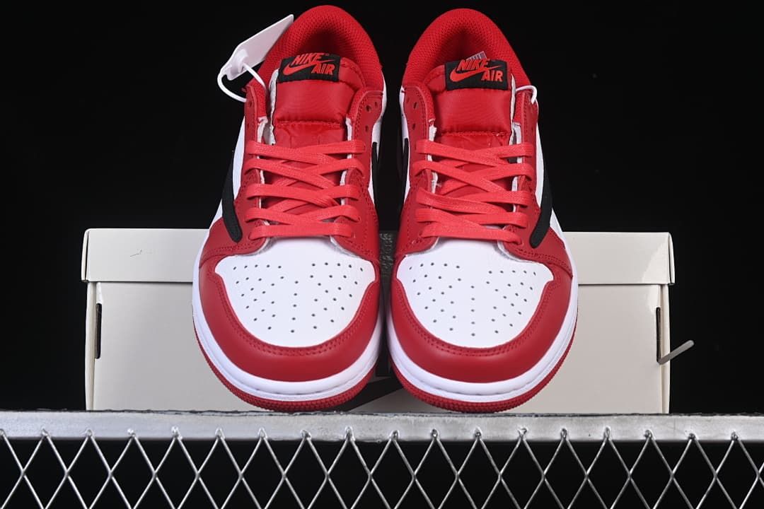 Front view of the pair showing red laces and perforated white toe panels.
