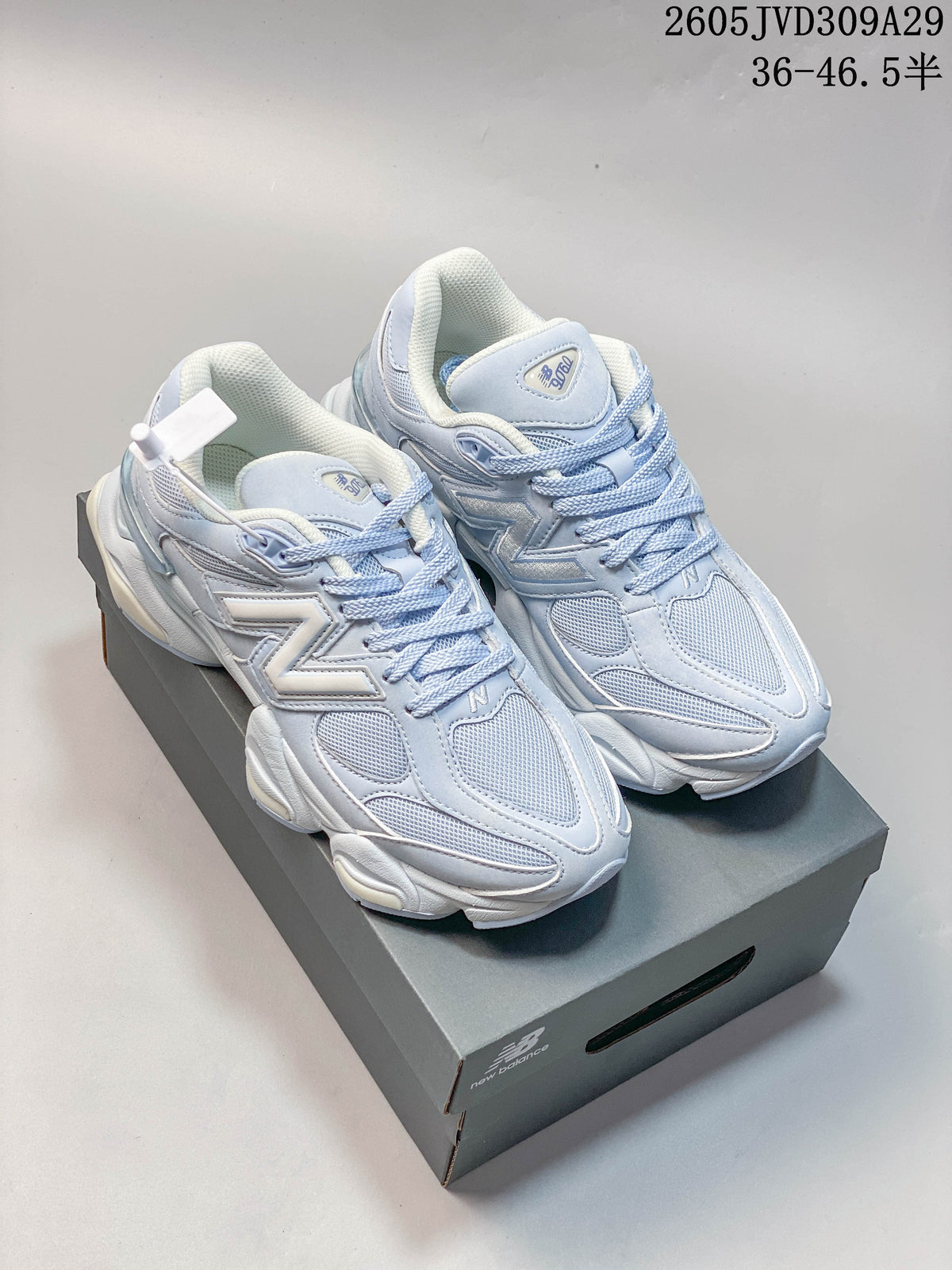 Pair of pale blue and white New Balance 9060 sneakers viewed from above, with a size-range overlay reading 36–46.5.