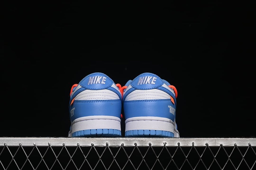 Rear view of both sneakers showing the heel panels and outsole.