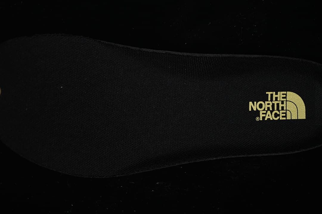 Close-up of the shoe insole with The North Face logo