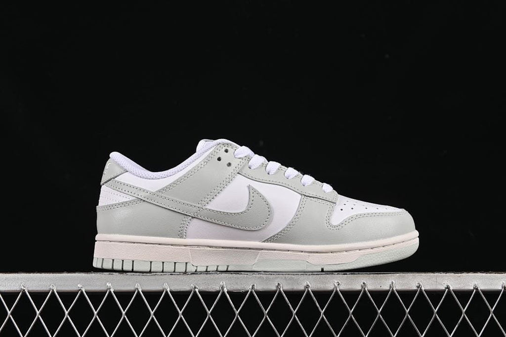 Side profile of a white and grey low-top sneaker