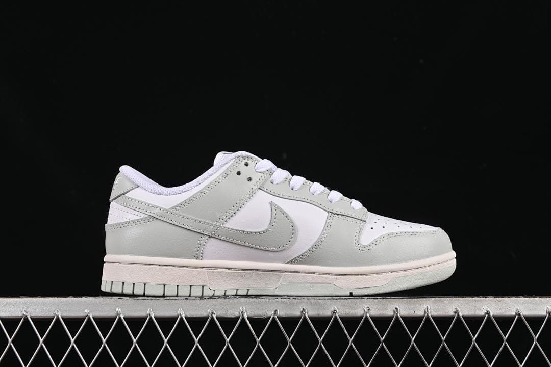 Side profile of a white and grey low-top sneaker