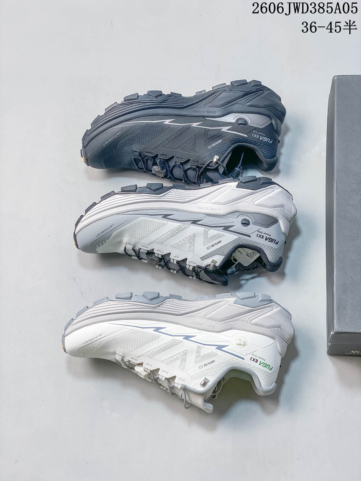 Three KAILAS Fuga Ex3 trail shoes shown in dark gray, white, and light gray