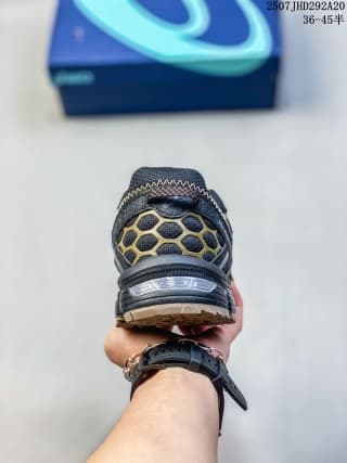 Rear view showing the textured heel section, padded collar, and layered outsole of the ASICS Gel-Kahana 8 FL sneaker.