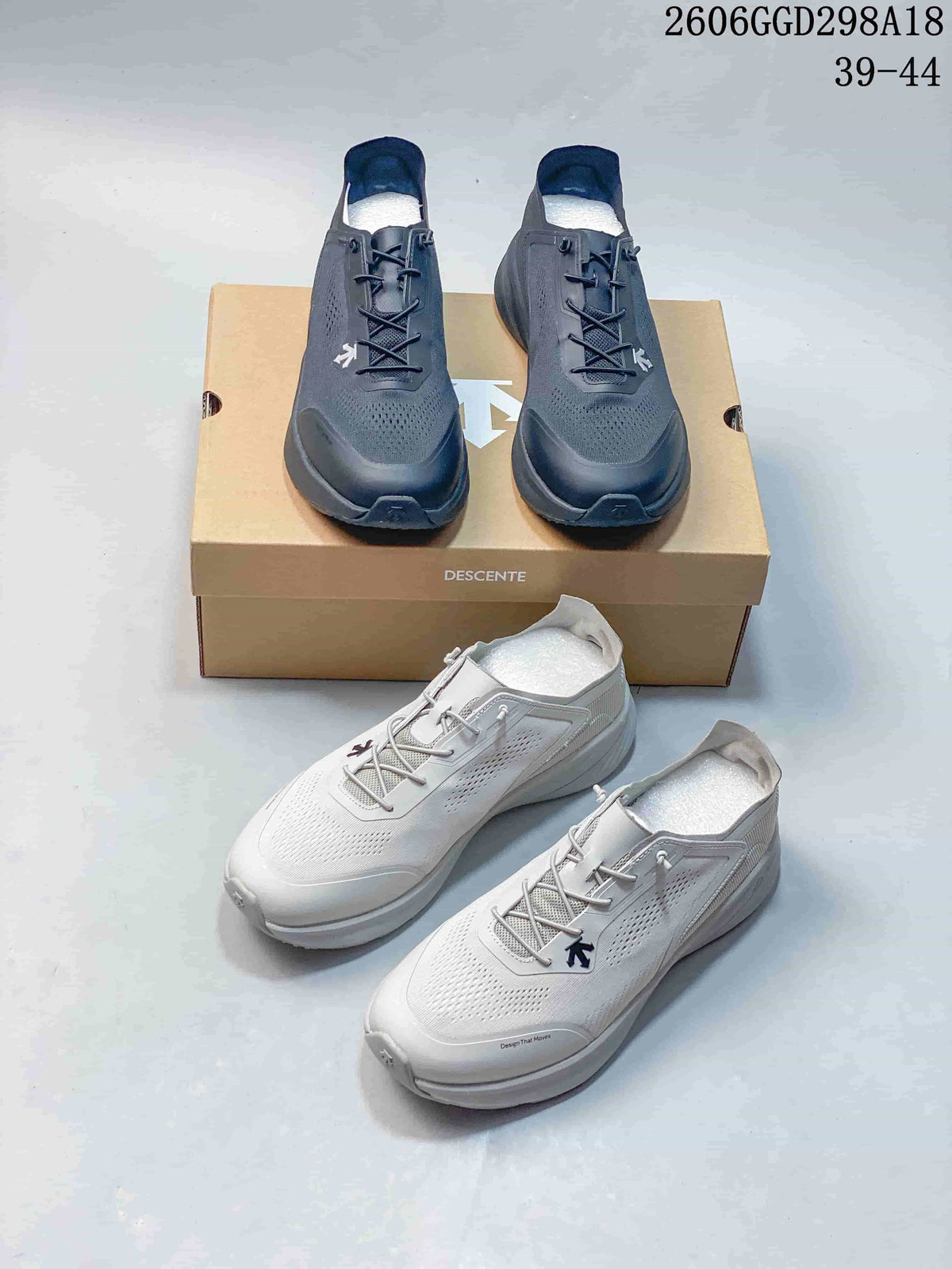 Dark navy and light gray DESCENTE running sneakers displayed together