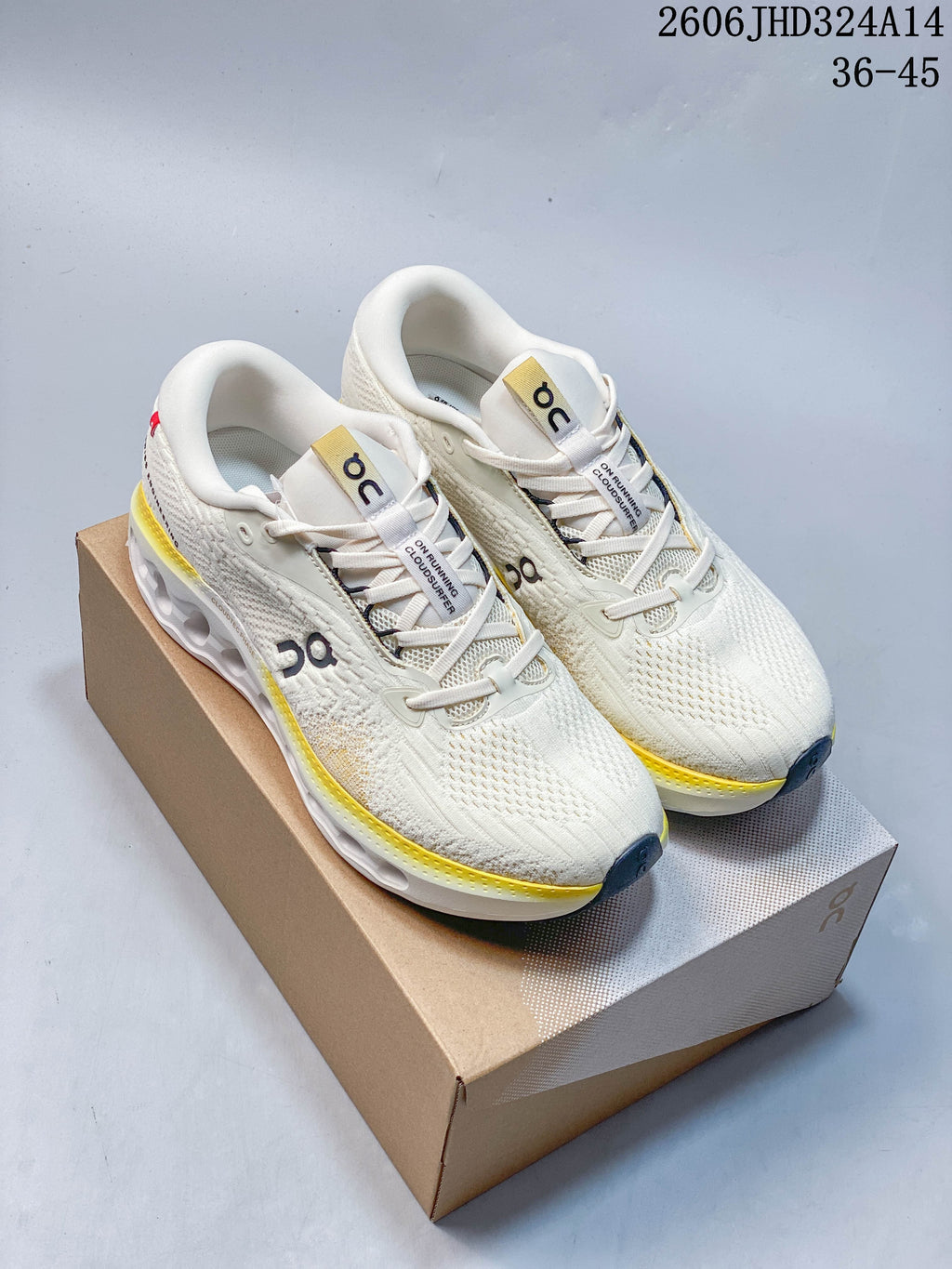Pair of white shoes with yellow accent details