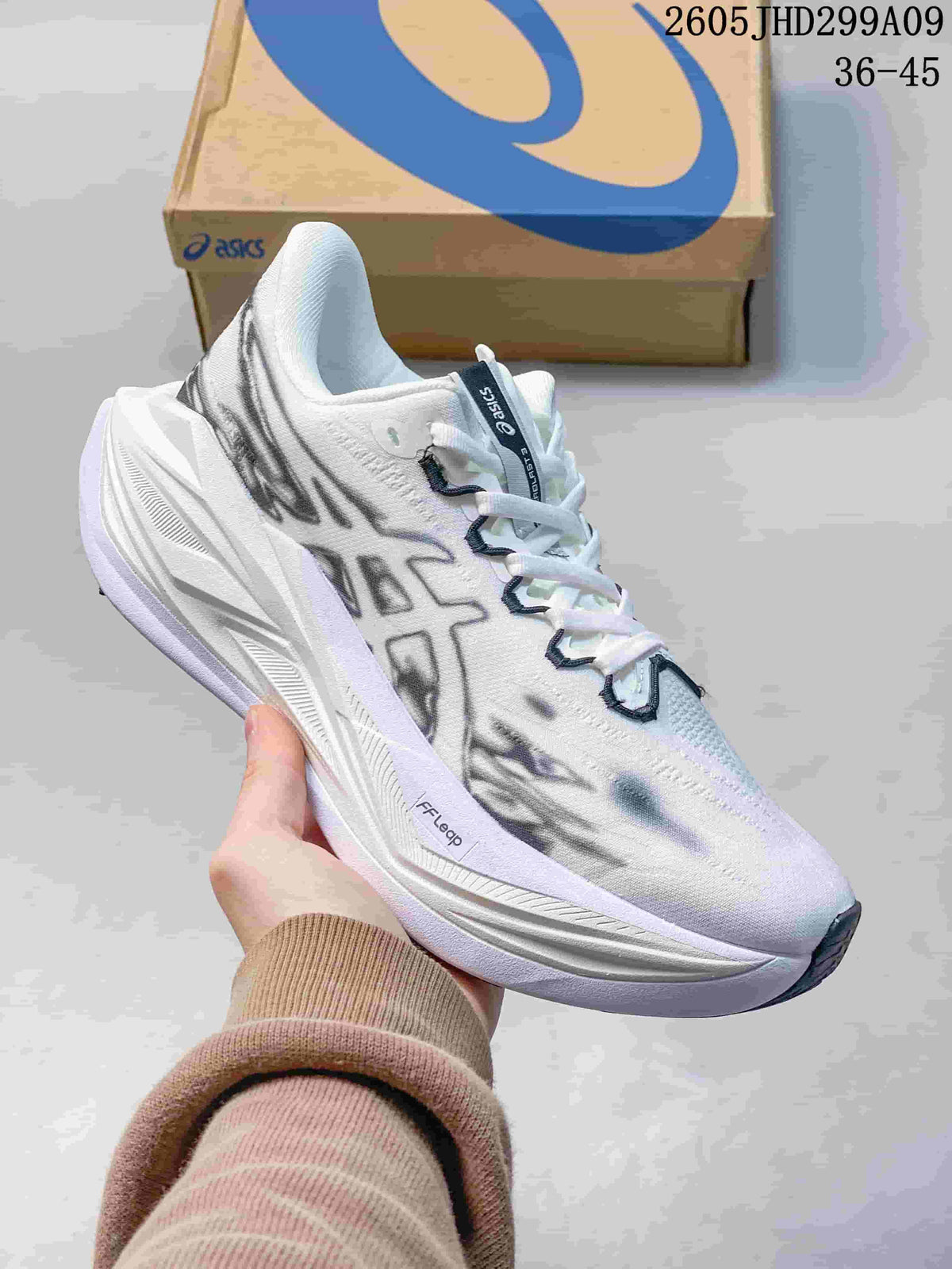 White ASICS Superblast 3 running shoe with dark graphic accents