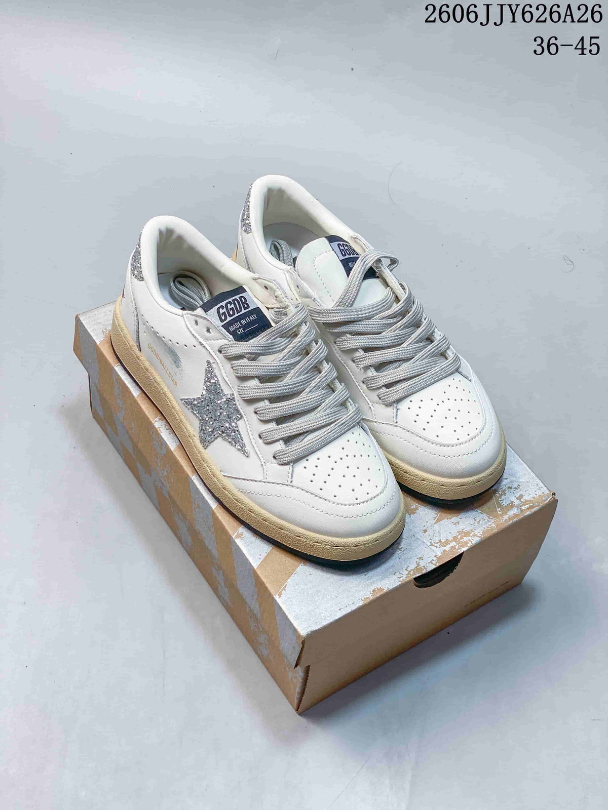 Three white low-top sneakers shown from the side, with silver or dark star details and contrasting sole trims.