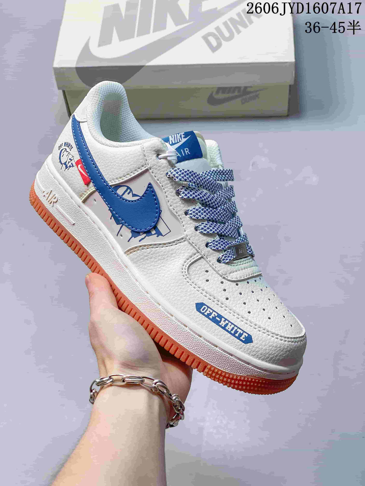 Angled view of the sneaker with blue accents, graphic details and gum-colored outsole