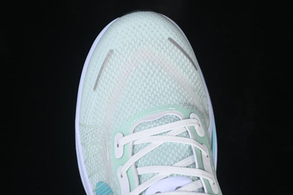 Top-down close-up of the mesh-look toe and lace area