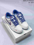 Pair of white Nike SB Dunk Low sneakers with blue and red accents on a shoe box