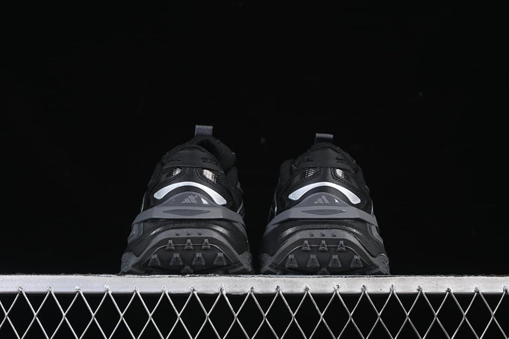 Rear view of the pair showing heel detailing and outsole tread