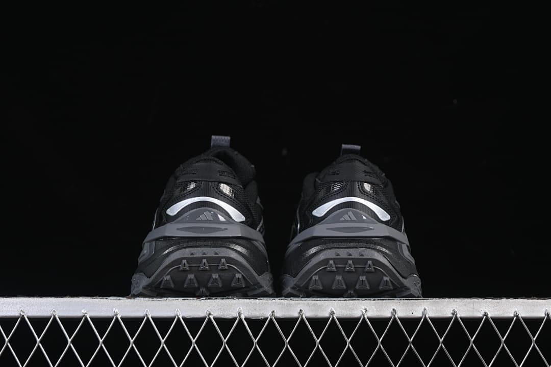 Rear view of the pair showing heel detailing and outsole tread