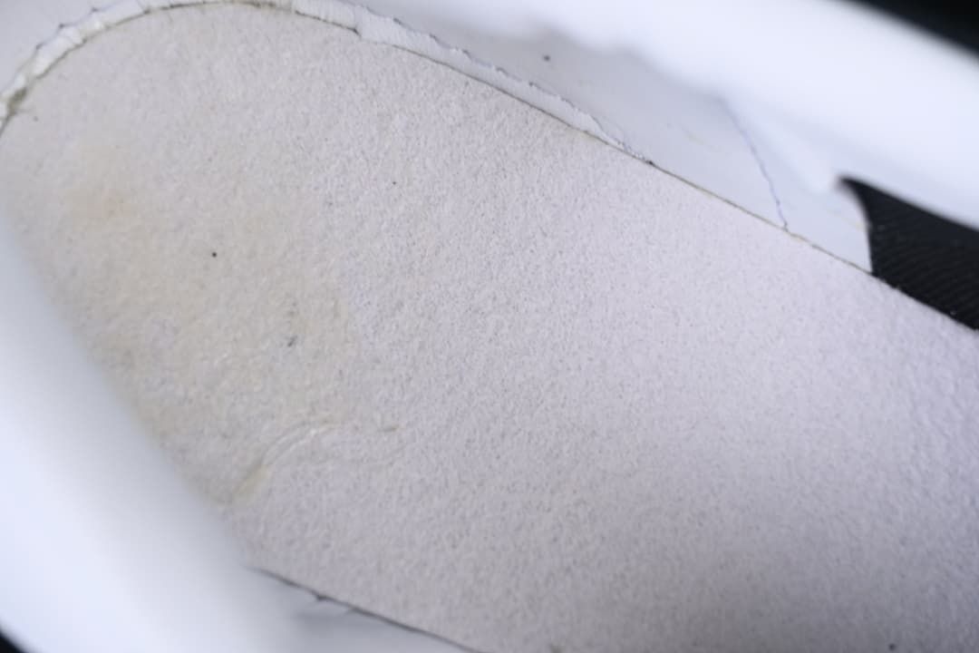 Close-up of the light-colored inner lining and stitching.