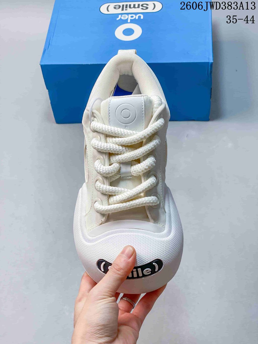 Front view highlighting the thick laces and Smile badge on the rounded toe