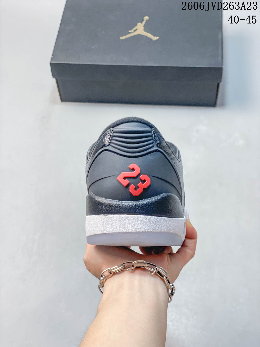 Rear view of the shoe showing a red number 23 detail and white midsole.
