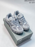 Light gray New Balance 997 sneakers photographed on a shoebox